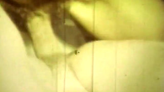 Worn Sepia Loop Captures Curly Retro Couple in Raw Bedroom Passion