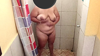 Taking a shower in a public restroom.