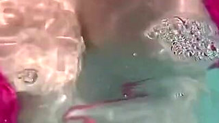 Artemisia Love Sexy and Horny Underwater Showing Her Big Tits in a Super Micro Bikini and You Can See Her Aureolas…