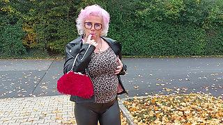 Naughty Granny Tongue Out Flashing Big Tits in Public