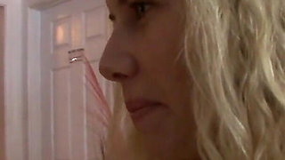 Two blonde babes play with each other