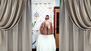 Hot mature housewife Lukerya undresses and teases with her huge tits in the kitchen