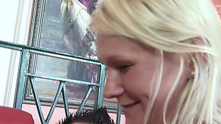 Busty Blonde MILF Sucks and Rides on the Red Sofa