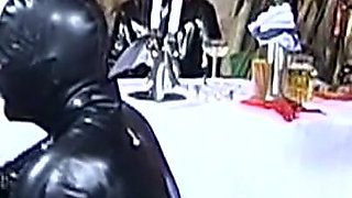 Elegant Latex Mistresses Tease Bound Rubber Slaves