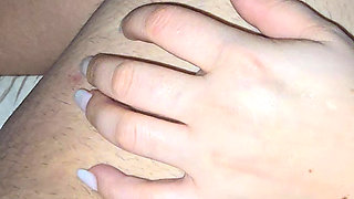 While step son look at his your phone step mom hand slip on his cock and give him a handjob,