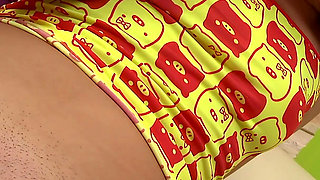 Redhead Babe Plays with a Silver Dildo While Sitting on a Chair