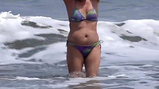 Beautiful Stepmother Takes Out Her Tits on the Beach and Masturbates.