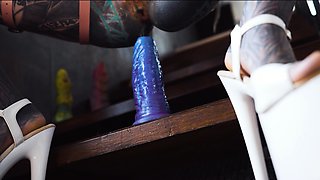 Gorgeous tattooed girl fucks her ass with a big dildo
