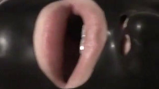 Latex Danielle in latex mask with purple dildo