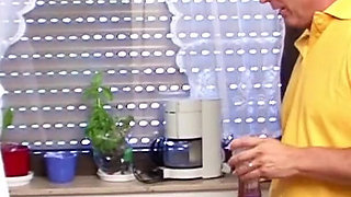 Wife is surprised by husband in the kitchen and lets herself be fucked