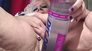 Big Bottle Plugged Clit Cunt