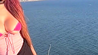 Artemisia Love Wearing Sexy Clothes and Smoking and Flashing Her Big Juicy Boobs in a Perfect Place by the Ocean
