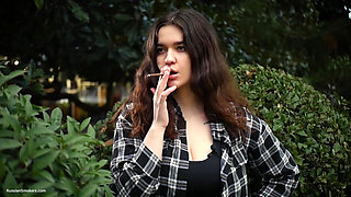Sweet and Busty Russian Babe Smoking Cigarette in Nature
