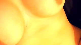 Busty curly brunette with big boobs fucks on couch