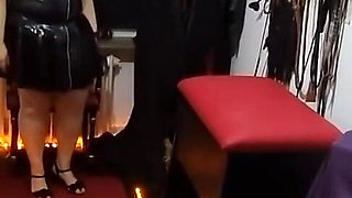 Busty Dominatrix Teases Bound Slave's Throbbing Cock in Dungeon