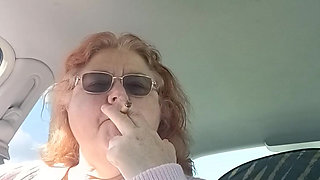 BBW smoking in pink sweater in her car talking to her fans
