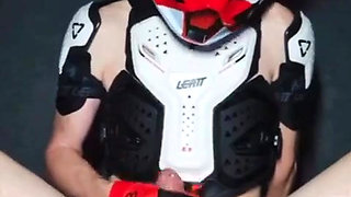 Naked Boy in Motocross Gear and Mxhelmet Gets a Strong Orgasm