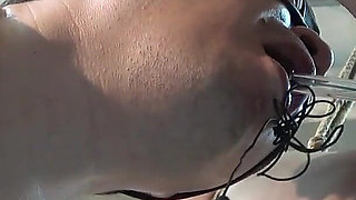 Mistress Whips Male Masochist Who Is Holding Dildo in His Mouth to Prevent It From Falling Out of Female Masochist Pussy