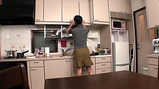 Japan's hottest babe, Miho, flaunts her massive naturals in the kitchen