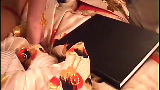 Man shoves cock in asian's mouth while she lays in bed