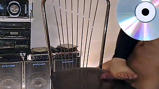 A mature woman in black leggings performs an intense ha