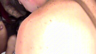 Sexy busty brunette sucks two cock in group sex