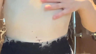 Petite Blonde Girl Doing a Striptease