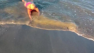 Try Not to Wet My Hair While Play with the Waves