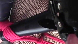 POV video of Laura tied up on her knees on high heels and fishnet pantyhose, fucked on her mouth with huge cumshot