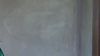 Sexy lesbian couple kiss passionately as they undress each other