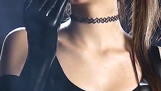 Brunette Smoking in Black Latex Outfit Slow Sensual Scene