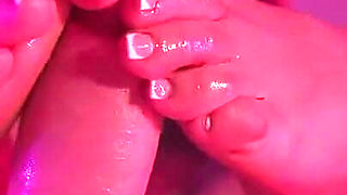 Tattooed MILF Gives Slippery Footjob to Throbbing Cock