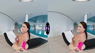 Glam teen Vixi Rafi poses by the pool in lingerie