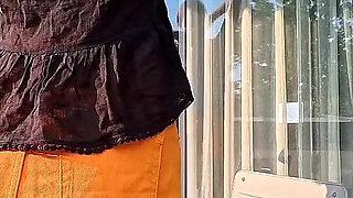 Hot Long Legs Sexy Beauty on the Balcony Flashes Her Panties Under Her Skirt Then Takes Underwear off to Show Tight Pussy