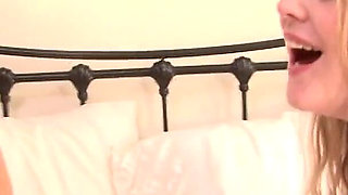 Lesbian Couple of Topless Beauties Enjoy Playful Time in Bed