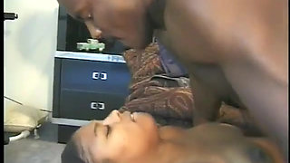 Big black guy licks pussy of naughty chocolate skinned chick and then fucks her on the bed