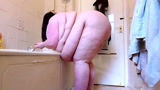 Naked SSBBW cleans lower camera view