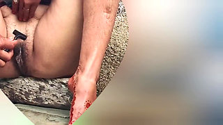 I see my step sister in the outdoor bathroom cleaning her pussy hair in the open bathroom and taking a bath.